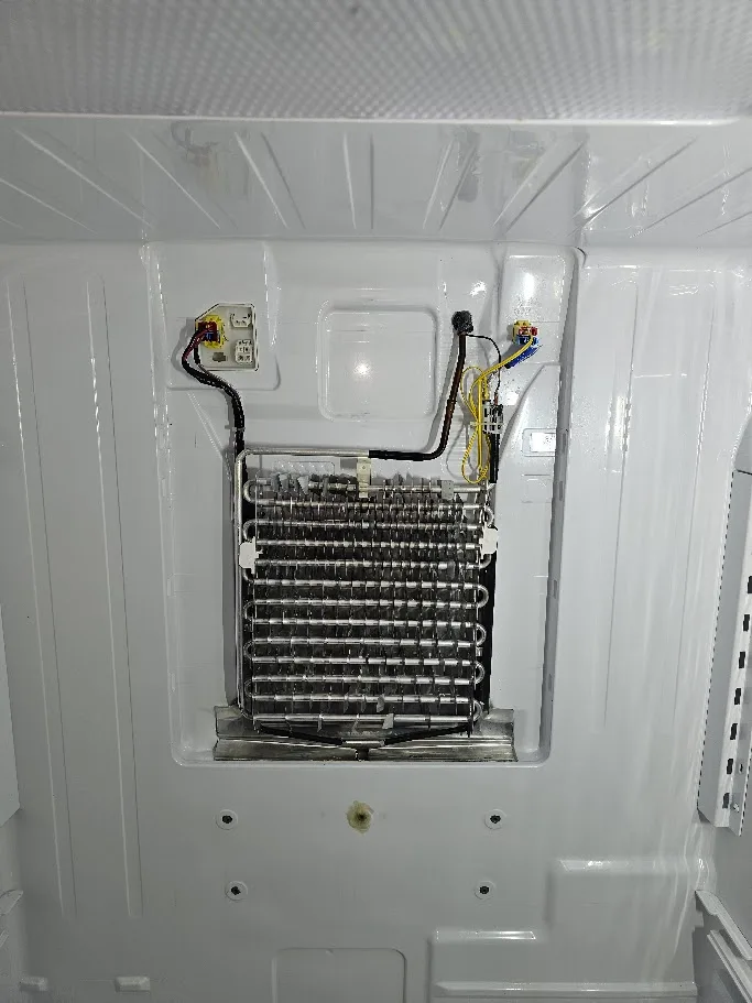 Water under Samsung refrigerator crisper drawers due to frozen drain