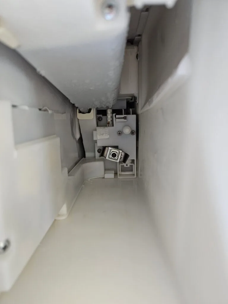 Samsung refrigerator ice maker compartment during repair