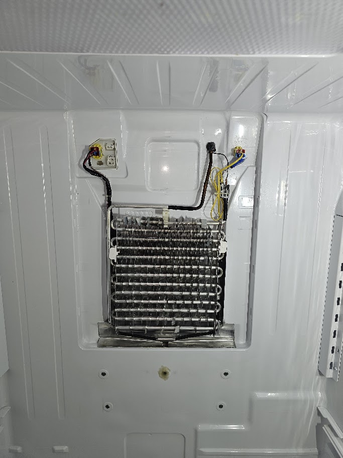 Water under Samsung refrigerator crisper drawers due to frozen drain